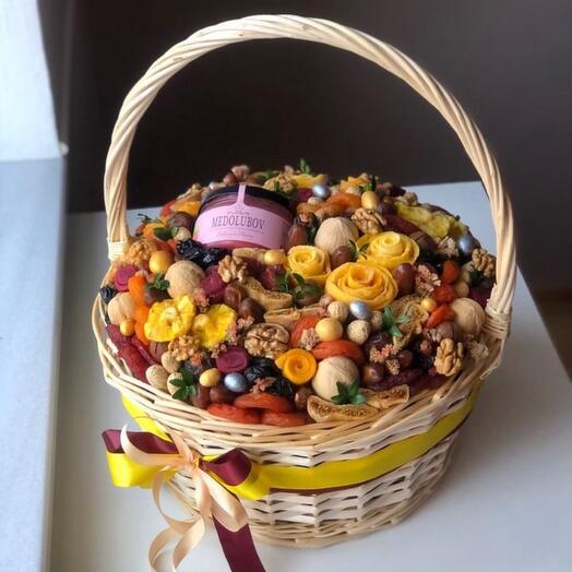 Dried fruits and nuts in a basket are an edible gift