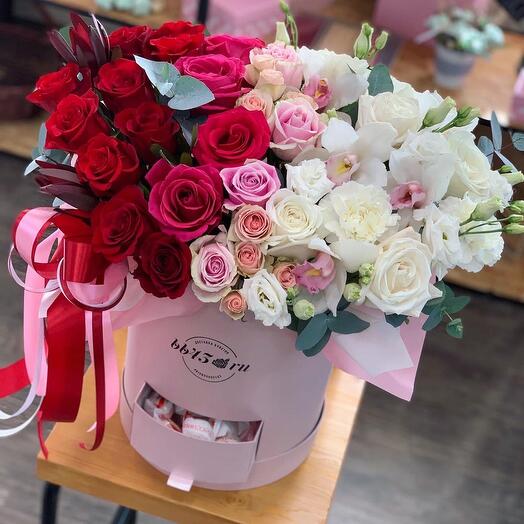 A box with flowers and sweets of large size