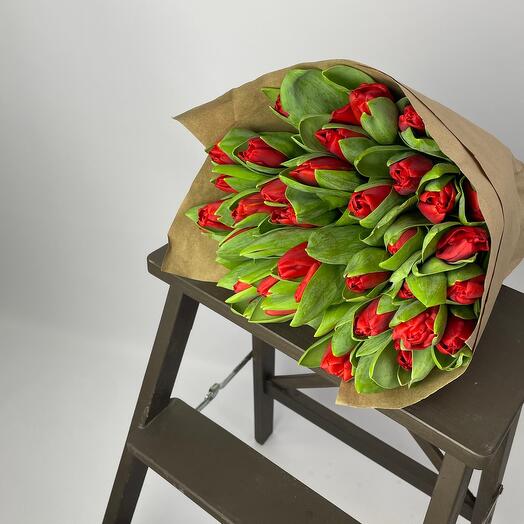 Red tulips in craft packaging