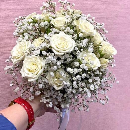 Bride's bouquet of bush roses and gypsophila