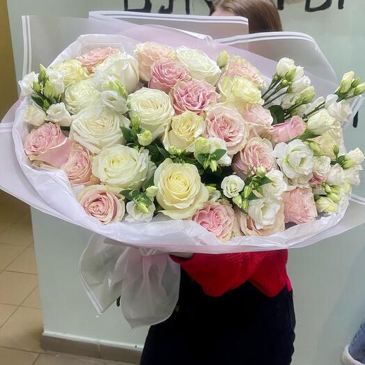 Delicate bouquet of roses and eustoma