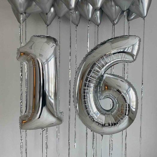 Balloons numbers and silver helium balloons in the ceiling in the rain