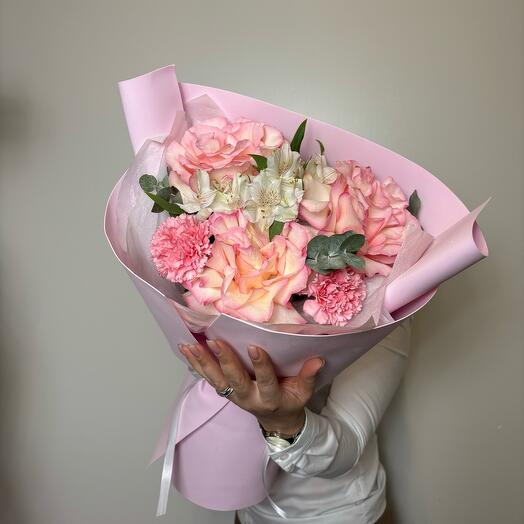 A combined fragrant bouquet of delicate roses, dianthus, alstroemeria with eucalyptus