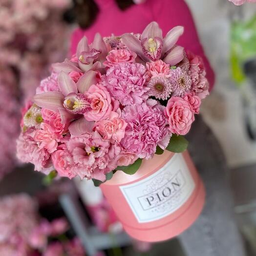 Flowers in a box with an orchid