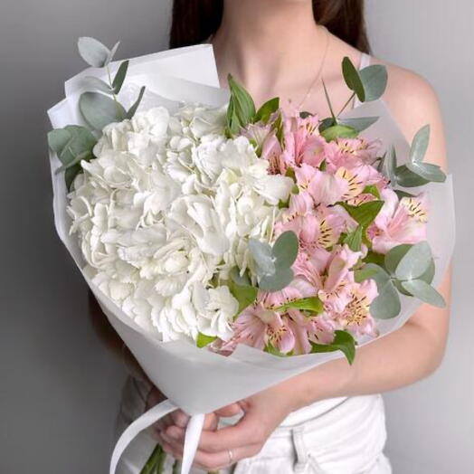Delicate bouquet of white hydrangea, pink alstroemeria and eucalyptus