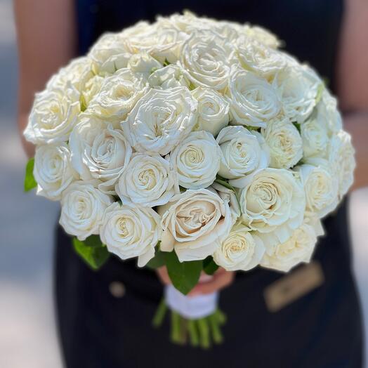 Wedding bouquet of bush and single-headed roses
