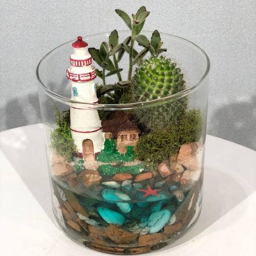 Mini florarium for desktop with succulent and lighthouse