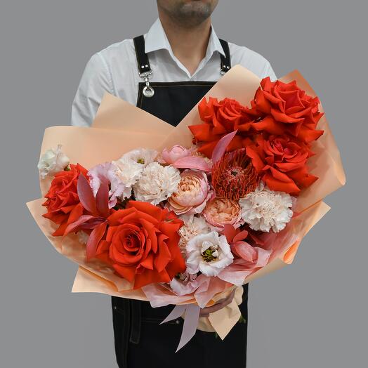 A bright bouquet with a French rose and a peony-shaped bush rose