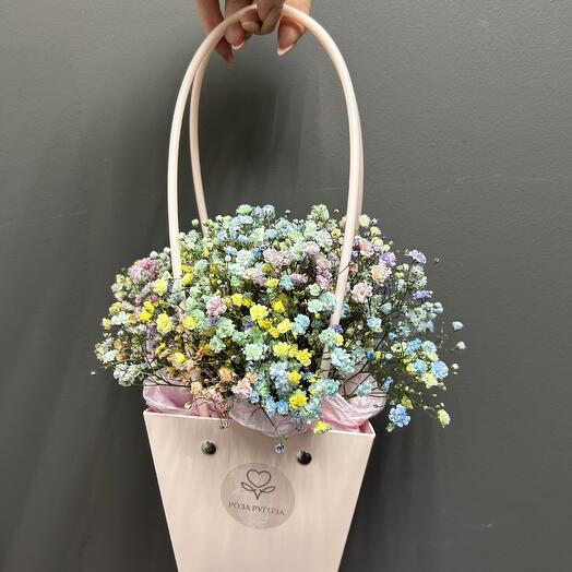 Colorful gypsophila in a handbag
