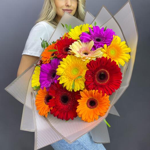 Bouquet of 15 gerberas mixed with greenery in a designer package