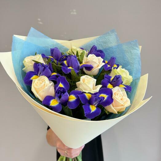 A bouquet of delicate roses and bright irises