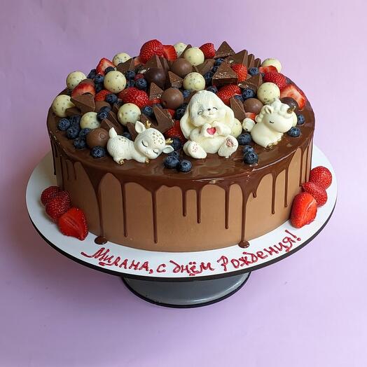 Pastel de bebé con figuras de chocolate
