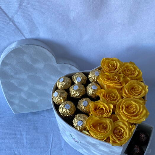 Flowers in a box with chocolate