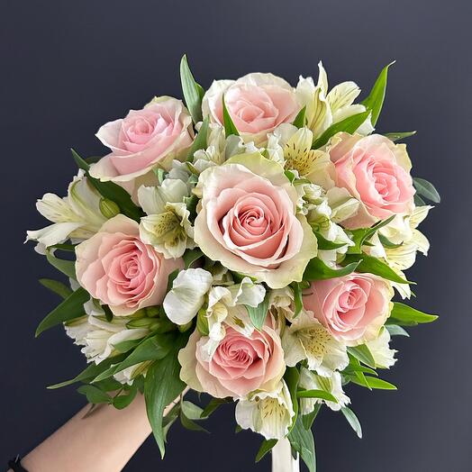 The bride's bouquet of delicate pink roses and alstroemeria