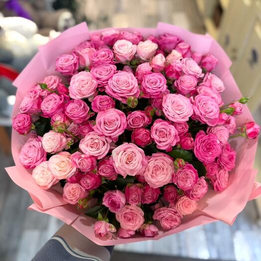 A bouquet of 37 bush roses in a delicate design