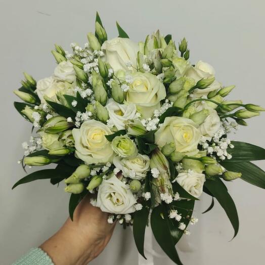 The bride's bouquet in white shades with greenery