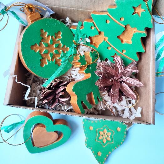 A set of Christmas tree decorations is a gift. Green