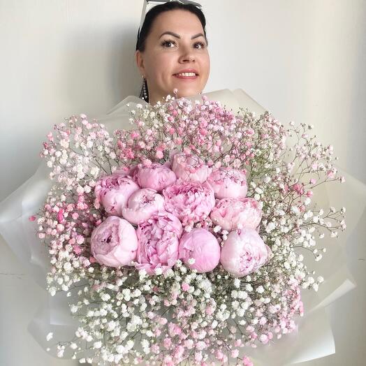 A delicate bouquet of 11 small peonies with gypsophila in an airy design