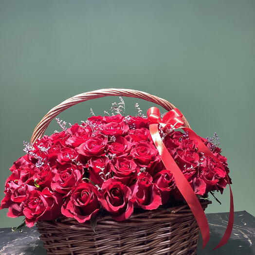 91 red roses in a basket