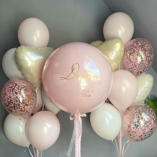 A large pink balloon with ANY inscription and fountains of balls and hearts