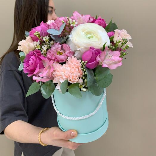 Box with ranunculus and bush peony roses