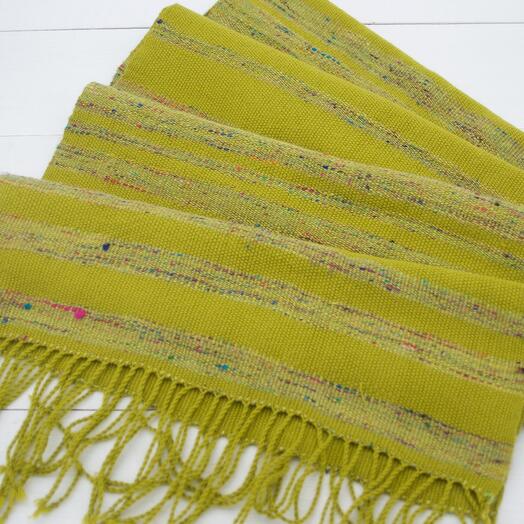A scarf woven by hand with a self-woven thread