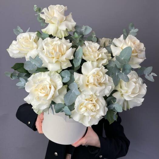 White roses with eucalyptus in a box