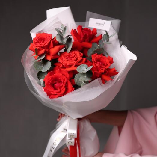Monobucket of scarlet roses and eucalyptus