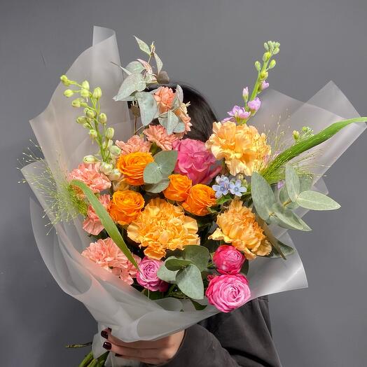 Bouquet with delphinium and bush rose