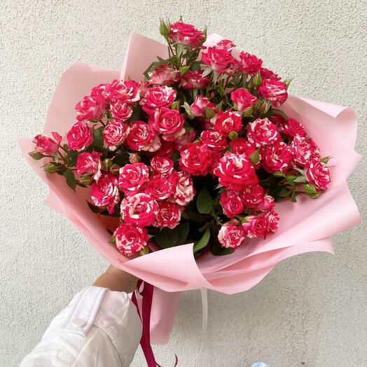 Bouquet of bush roses in a matte film