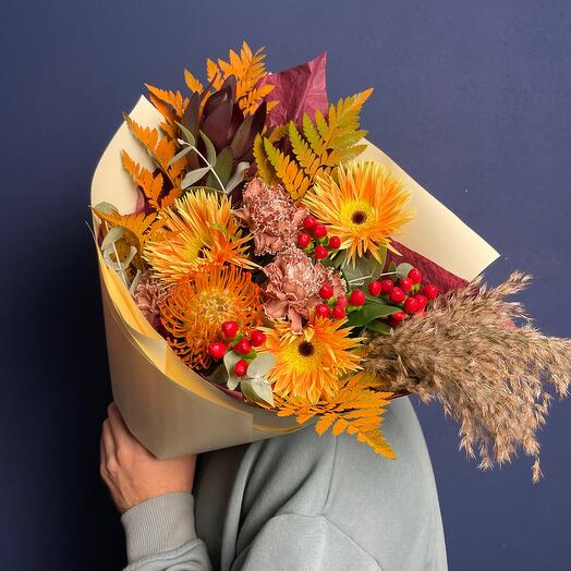 A bright autumn bouquet is a compliment with varietal dianthuses and gerberas with pampas twigs