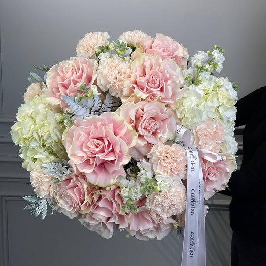 A gorgeous delicate bouquet of hydrangeas and French roses in delicate pink shades