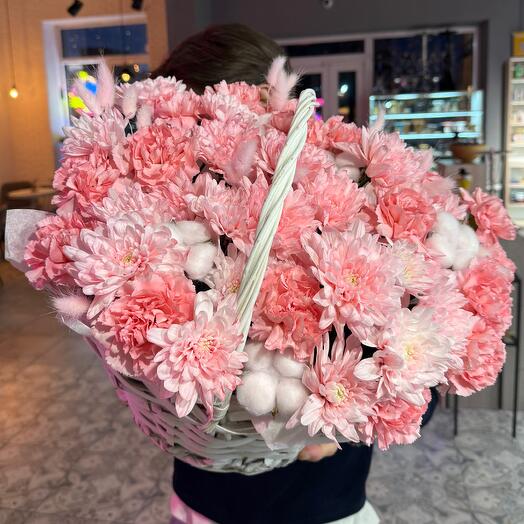 Basket with chrysanthemums for a girl