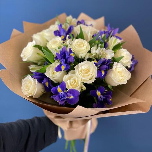 Bouquet of white roses with alstroemeria and irises in craft