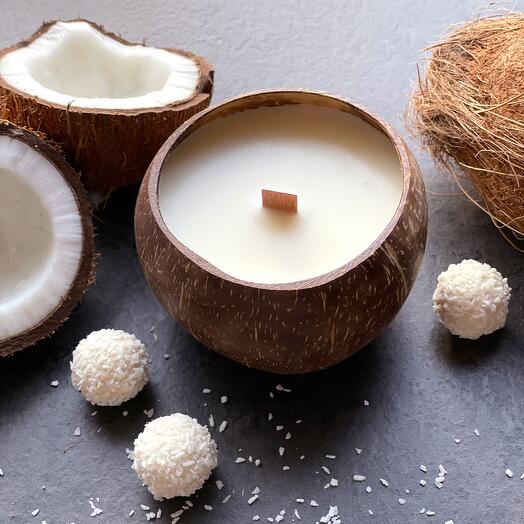 Scented candle in natural coconut shell