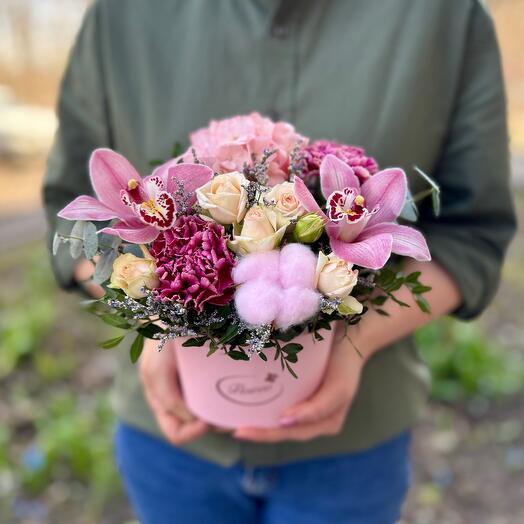 Orchids and assorted flowers in a box