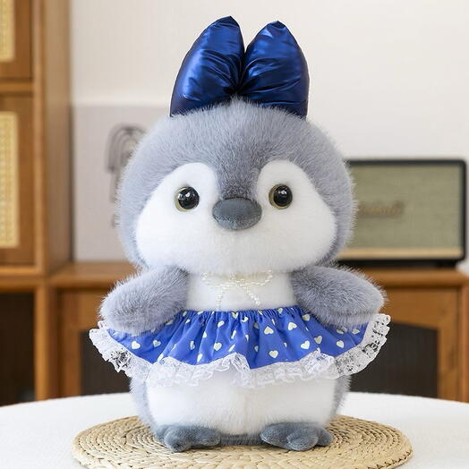 Plush penguin with a bow