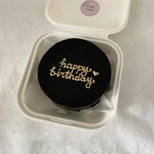 Bento cake with golden inscription