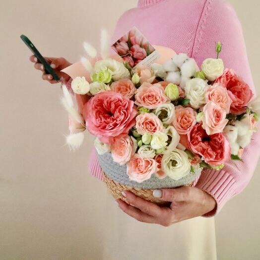 Basket with peony-shaped roses, eustoma and bush rose
