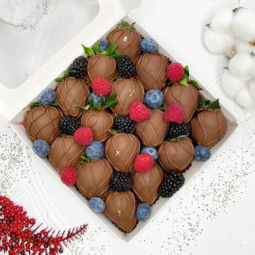 Chocolate covered strawberries with berries