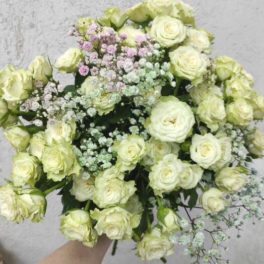 Bush rose with gypsophila under the ribbon