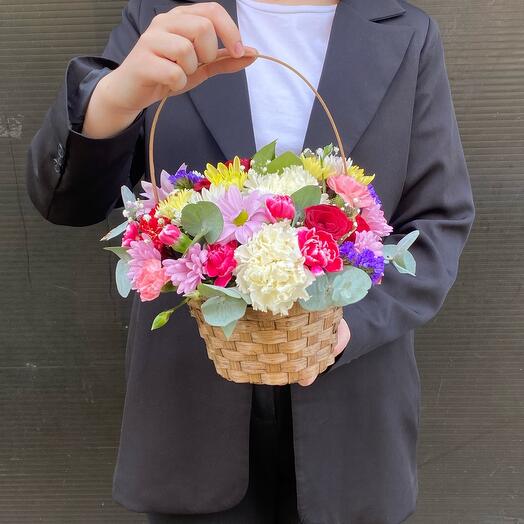 Basket with beautiful bright flowers