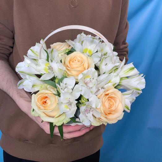 Basket with peach roses and alstroemeria