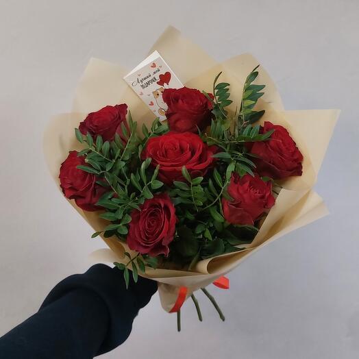 7 red roses with greenery