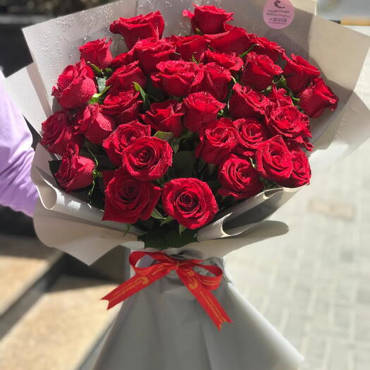 30 Stems of Red Roses in a brown wrapping