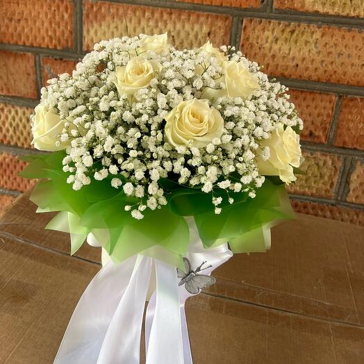 Flowers in a box with a white rose