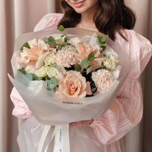 Delicate bouquet of French milk roses, bush roses and dianthus with eucalyptus twigs