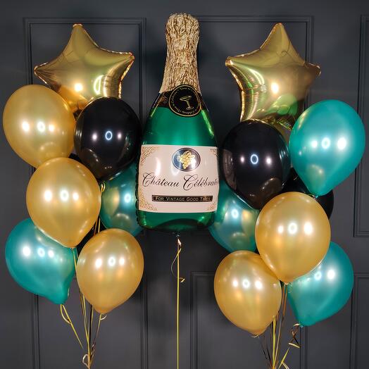 Composition of black green and gold balls with champagne