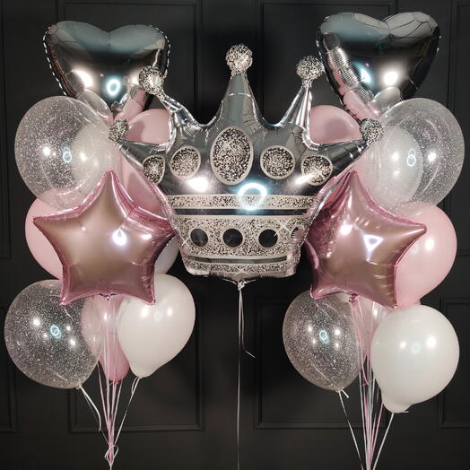 Composition of pink and white balloons with a silver crown