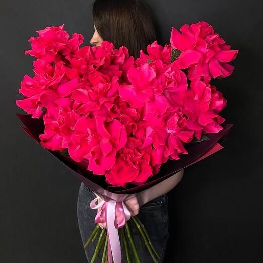 A bouquet of crimson French roses in the shape of a heart